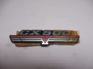 87125-415-670 Emblem side cover Honda CX500 new