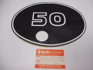 68141-26560-064 Emblem frame cover Suzuki TS 50ER new