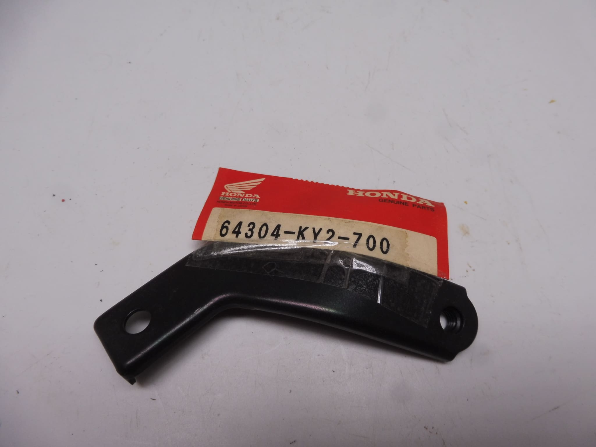 64304-KY2-700 Stay A cowling R. Honda CBR400RR '88- NC23 new